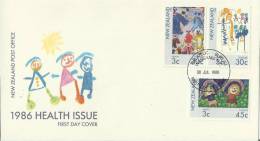 NEW ZEALAND 1986 – FDC HEALTH STAMPS – CHILDREN DESIGNS   W 3 STS :(2) OF 3-30 C; (1) OF 3-45 C POSTM WANGANUI JUL 30 RE - FDC