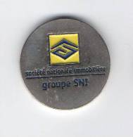 Jeton  De  Caddie  Argenté  Groupe  S N I  Société  Nationale  Immobilière  Verso  1 € - Trolley Token/Shopping Trolley Chip