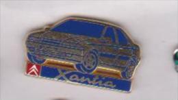 Pin's CITROEN XANTIA  Signé ARTHUS BERTRAND - Citroën