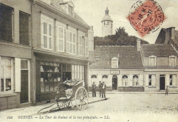 NORD PAS DE CALAIS - 62 - PAS DE CALAIS - GUINES - CPM GF (repro) - La Tour Et La Rue Principale - Pliures Diffuses - Guines