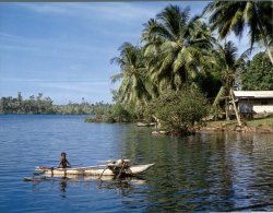 (303) Papua New Guinea - Boy In Canoe - Papua New Guinea