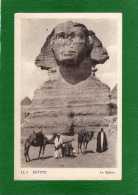 EGYPTE LE SPHINX EN L'ETAT  Cpa  Animée  Avec Des Marchands Et Leur Chameaux EDIT  L L .1 - Sphinx