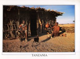 (320) Tanzania - Local Men And Women In Front Of House - Tanzania