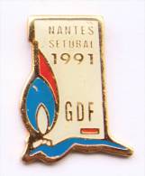 Pin's GDF - NANTES (44) - SETUBAL 1991 - La Flamme - Stadium - C990 - EDF GDF