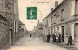 CPA - MOUY - RUE DE PARIS - CAFE BILLARD HENNEGRAVE LALLEMAND - CHOCOLAT IBLED - Trés Animée - N/b - Vers 1910 - - Mouy