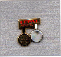 Pin´s   Marque  TEFAL  Resistal  Signé  Arthus  Bertrand - Arthus Bertrand