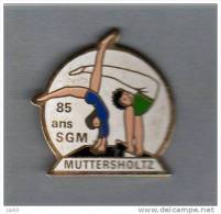Pin´s  Sport  Gymnastique,  85 Ans  De La  S.G.M  MUTTERSHOLTZ  ( 68 ) - Gymnastics