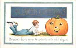 225403-Halloween, Whitney No WNY12-1, Boy Lying On Ground Facing Jack O Lantern - Halloween