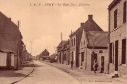 AUBY  ( NORD ) La Rue Jean Jaurès Edit Dessaint Peu Courante ( Femme Bicyclette Chien …) - Auby