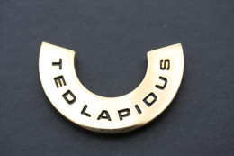 Applique Laiton Poli "Ted Lapidus" Pour Article De Maroquinerie - Botones