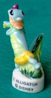 1 FEVE DISNEY L'ALLIGATOR CERAMIQUE NEUVE (GALETTE DES ROIS, FETE, ANNIVERSAIRE...) - Disney