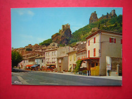 Delcampe - CPM 07    ROCHEMAURE   LA NATIONALE N° 86 LE CENTRE DU VILLAGE AU FOND LES RUINES DU CHATEAU FEODAL   NON VOYAGEE  TBEG - Rochemaure