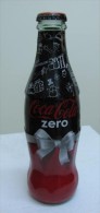 AC - COCA COLA ZERO - HAPPY NEW YEAR 2010 SHRINK WRAPPED EMPTY GLASS BOTTLE - Botellas