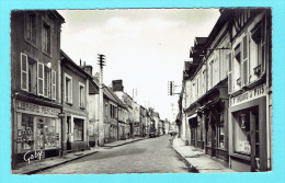 CPSM LE MERLERAULT La Grande Rue - Commerces Librairie Mercerie - Canton De Rai - Le Merlerault