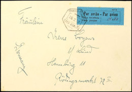 1928, Luftpostbrief Vom 26.2.1938 Mit Zweisprachigem Blauem Taxe-Aufkleber "Por Aviao - Taxa Recebida", Absender... - Mozambique