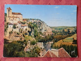 Dep 46 , Cpm Saint CIRQ LAPOPIE , L'Eglise Et Le Village , EKB 2988 (063) - Saint-Cirq-Lapopie