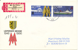 Germany DDR Registered Postal Stationery Cover Leipziger Messe 1946 - 1986 Sent To Bonn 10-12-1986 - Umschläge - Gebraucht
