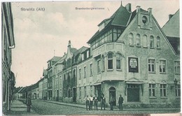NEUSTRELITZ Alt Brandenburger Straße Belebt Gelaufen Grünlich 6.1.1915 Tabak & Cigarren Versandhaus - Neustrelitz