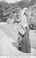 NEPAL / Nepalese Woman Carrying Child - Nepal