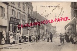 70 -  LURE - LA RUE DE LA GARE - A LA MAISON BLEUE   1916 - Autres & Non Classés