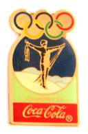 Pin's COCA COLA - 1° J.O D'hiver CHAMONIX 1924 - Homme Bras En Croix - Anneaux Olympiques - Premier  - G848 - Coca-Cola