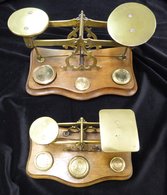 POSTAL SCALES 19thC Two Early Sets Of Brass Scales On Wooden Serpentine Boxes, Each Having Three Or Four Weights (one Se - Autres & Non Classés