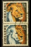1980 LION 11C - IMPRESSIVE MISSING COLOUR PAIR 11c Lion, SG 582, Vertical Pair, Showing Large Area Of Colours Missing, W - Zimbabwe (1980-...)