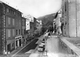 CPSM Dentelée - SAINT-PONS (34) - Aspect De La Rue Principale Et De L'auto Ecole Dans Les Années 50 / 60 - Saint-Pons-de-Mauchiens