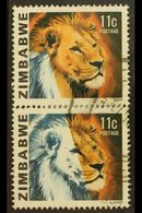 1980 LION 11C - IMPRESSIVE MISSING COLOUR PAIR  11c Lion, SG 582, Vertical Pair, Showing Large Area Of Colours Missing,  - Zimbabwe (1980-...)