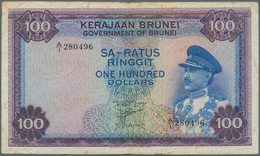 01174 Brunei: 100 Ringgit 1967 P. 5, Used With Several Folds And Creases, Stained Paper, No Holes Or Tears - Brunei