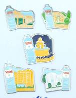 Delcampe - Lots De 5 Pin's EAU DE VITTEL Différents - La Galerie Thermale - Le Vittel Palace - Le Casino - Le Griffon Etc - H247 - Lots