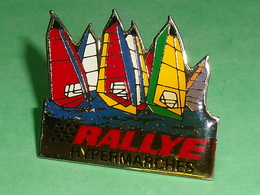 Pin's / Voile  : Rallye Hypermarches 40 X 35 Mm  TB1Y - Voile