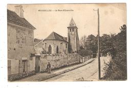 CPA 95 MOISSELLES Rue D'Ezanville église Maisons 1920 - Moisselles