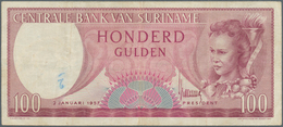 Suriname: 100 Gulden 1957 P. 114, Used With Folds And Stain In Paper, Pressed, Condition: F. - Suriname