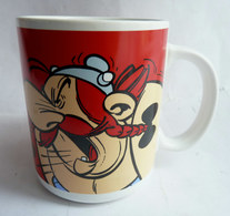 MUG TASSE EN FAIENCE ROUGE PARC ASTERIX 2000 OBELIX - Arte Della Tavola