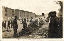** T2/T3 Greek Soldiers Roasting Meat On The Street. Photo - Unclassified