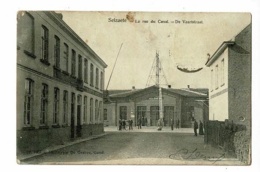 Selzaete - Zelzate - La Rue Du Canal - De Vaarstraat (commerces, Gare , Animation ) Circulé 1909, Timbre Décollé - Zelzate