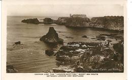 REAL PHOTOGRAPHIC POSTCARD DUMBAR CASTLE AND ROCKS - Advertising Carron Line - London-Scottish Sea Route - East Lothian