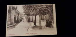 Delcampe - Cp 91 ETRECHY La Rue Fontaine ( Animation Habitations Commerce J ADOU Pub Chocolat Menier Amidon Puit Pompe A Volant - Etrechy