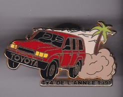 Pin's  TOYOTA 4X4 DE L'ANNEE 1991 SIGNE ARTHUS BERTRAND - Toyota