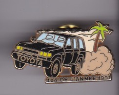 Pin's TOYOTA 4X4 DE L'ANNEE 1991 SIGNE ARTHUS BERTRAND - Toyota