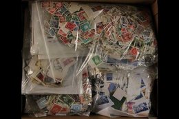 WORLD HOARD IN LARGE PACKS 20th Century Used Loose Stamps In Several Large Plastic Packs, Some On Pieces, Unsorted And U - Other & Unclassified
