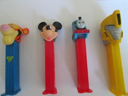 PEZ, FOUR DISPENSERS, MICKEY MOUSE, TRAIN,  LION, TRANSFORMERS - Pez