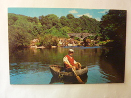 A CORACLE FISHERMANN AT CENARTH - Carmarthenshire