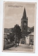 SAINT ETIENNE DE TINEE (06) - ENTREE DU VILLAGE ET L'EGLISE - Saint-Etienne-de-Tinée