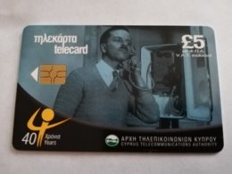 CYPRUS  Phonecard  5 POUND 40  YEARS  CHIPCARD   MAN ON PHONE   ** 1847 ** - Cyprus