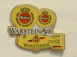 PIN'S MONTGOLFIERE - DIRIGEABLE - ZEPPELIN - BIERE WARSTEINER - Montgolfières