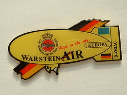 PIN'S MONTGOLFIERE - DIRIGEABLE - ZEPPELIN - BIERE WARSTEINER - Montgolfières