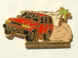 PIN'S TOYOTA STATION WAGON ROUGE - 4 X 4 DE L'ANNEE 1991 - ARTHUS BERTRAND - Toyota