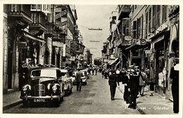 Gibraltar, Main Street, Shops, Cars, Sailors (1950s) Postcard - Gibilterra